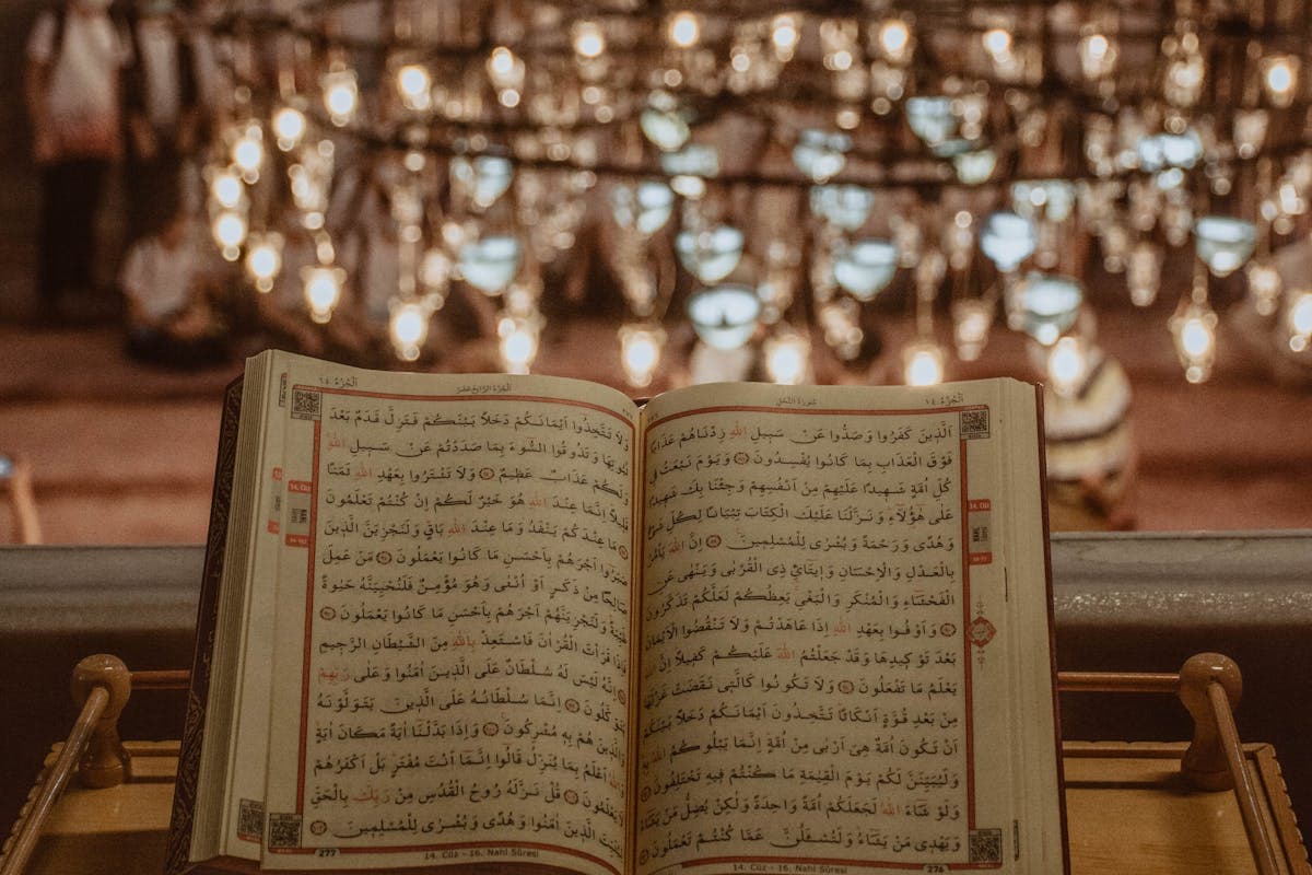 Open Quran on stand, learn Tajweed online with certified female teacher